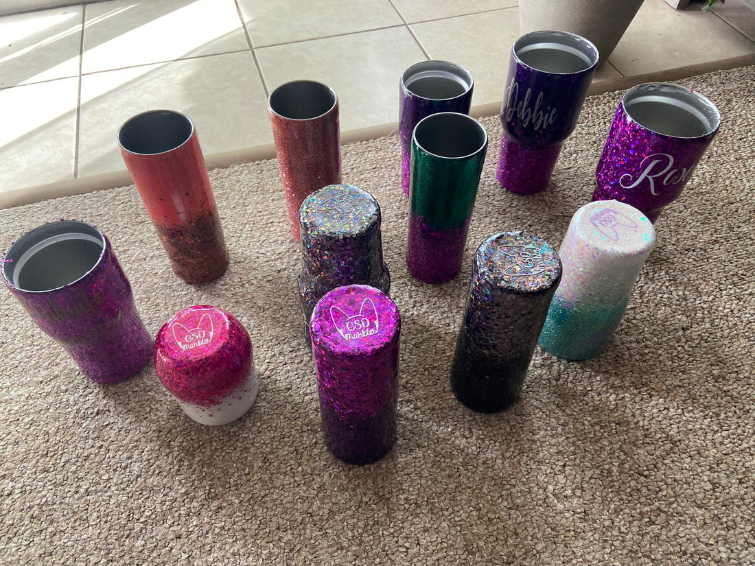 Custom "Design-Your-Own" glitter tumblers with personalized names, showcasing a variety of glitter color combinations.