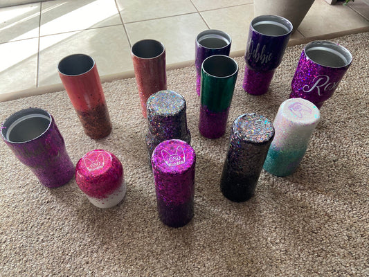 Custom "Design-Your-Own" glitter tumblers with personalized names, showcasing a variety of glitter color combinations.