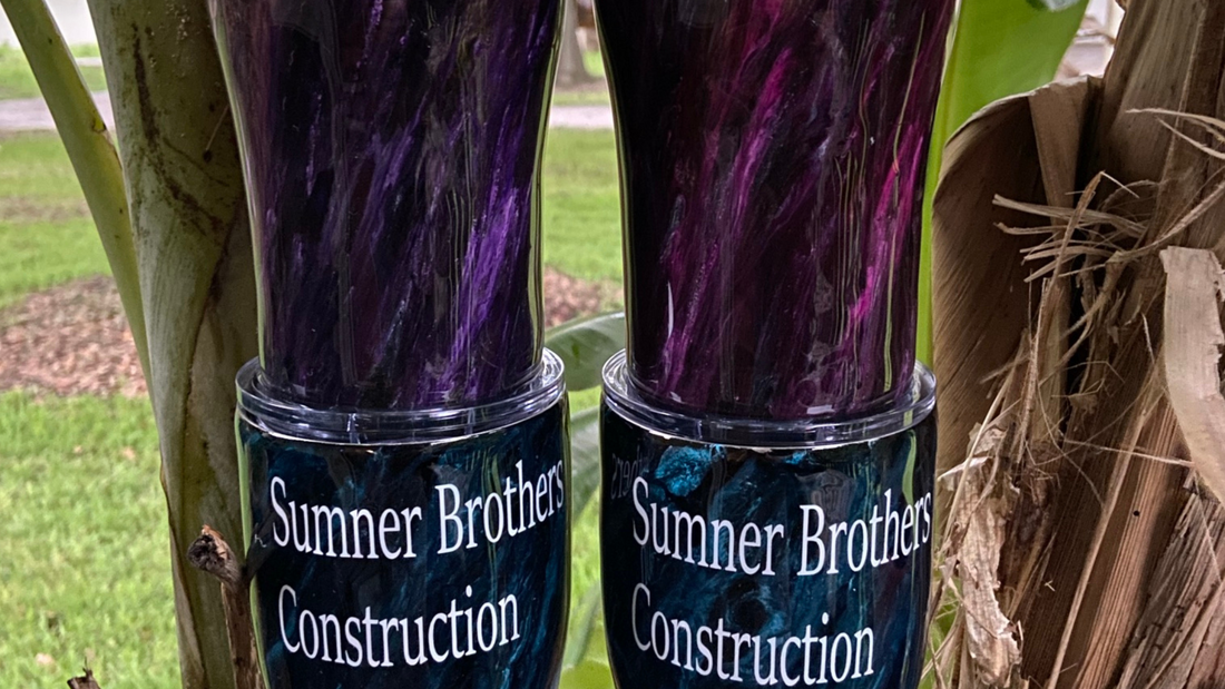 Custom tumblers with a business logo, showcasing personalized branding for businesses.