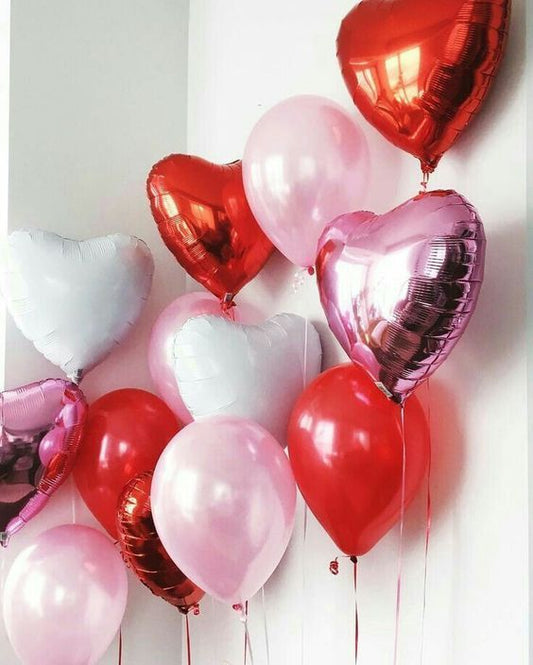 Festive Valentine's Day heart balloons in shades of red and pink, symbolizing love and celebration.
